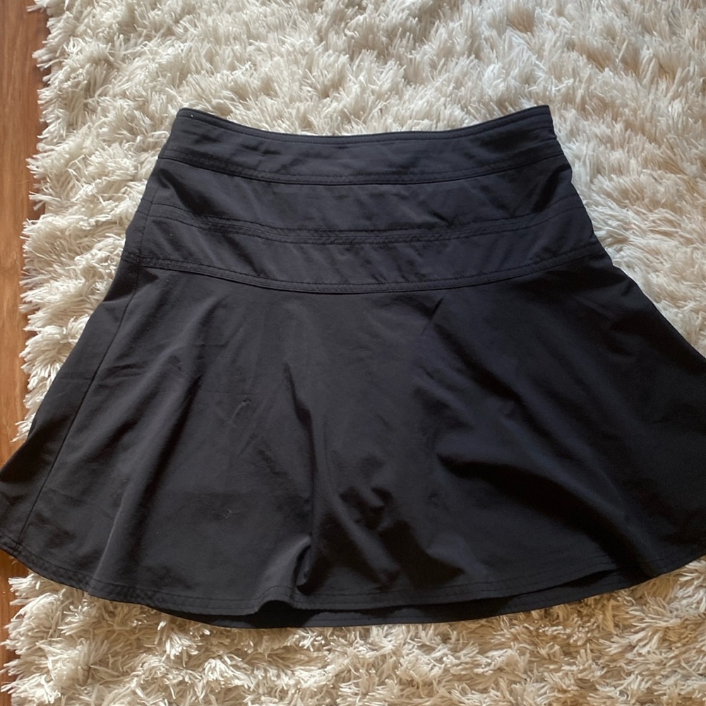 Athleta black skirt with shorts underneath size and back zipper. Size 2